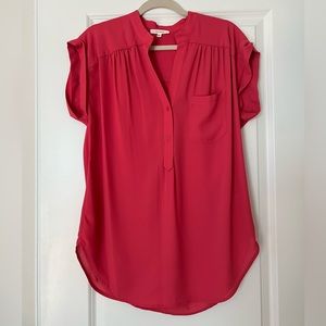 Pink longer style top.